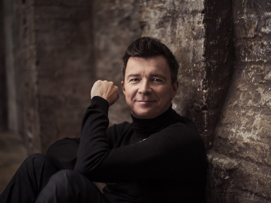 "If you look back at photographs of yourself from many years back, you probably look at them and cringe a little bit. I'm in that same boat," Rick Astley says of his '80s music videos.
